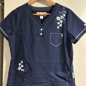 Women’s Koi brand Dark Blue Short Sleeve scrub top and matching bottoms
